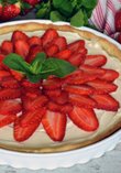 White chocolate mousse with fresh strawberries and mint leaves